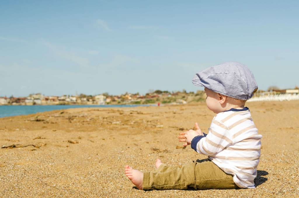 baby on holiday at beach